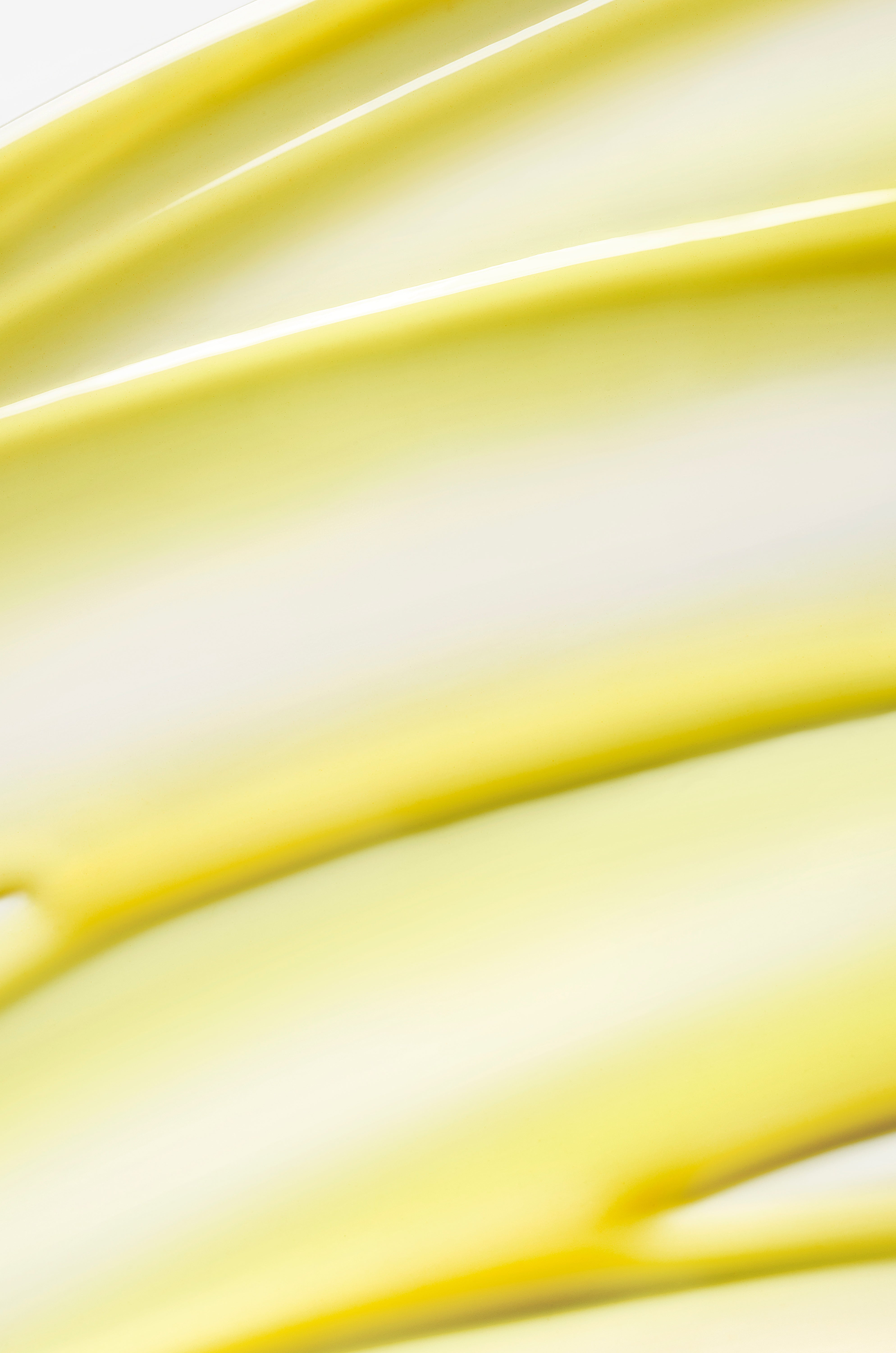 Close-up of yellow serum with a soft focus background