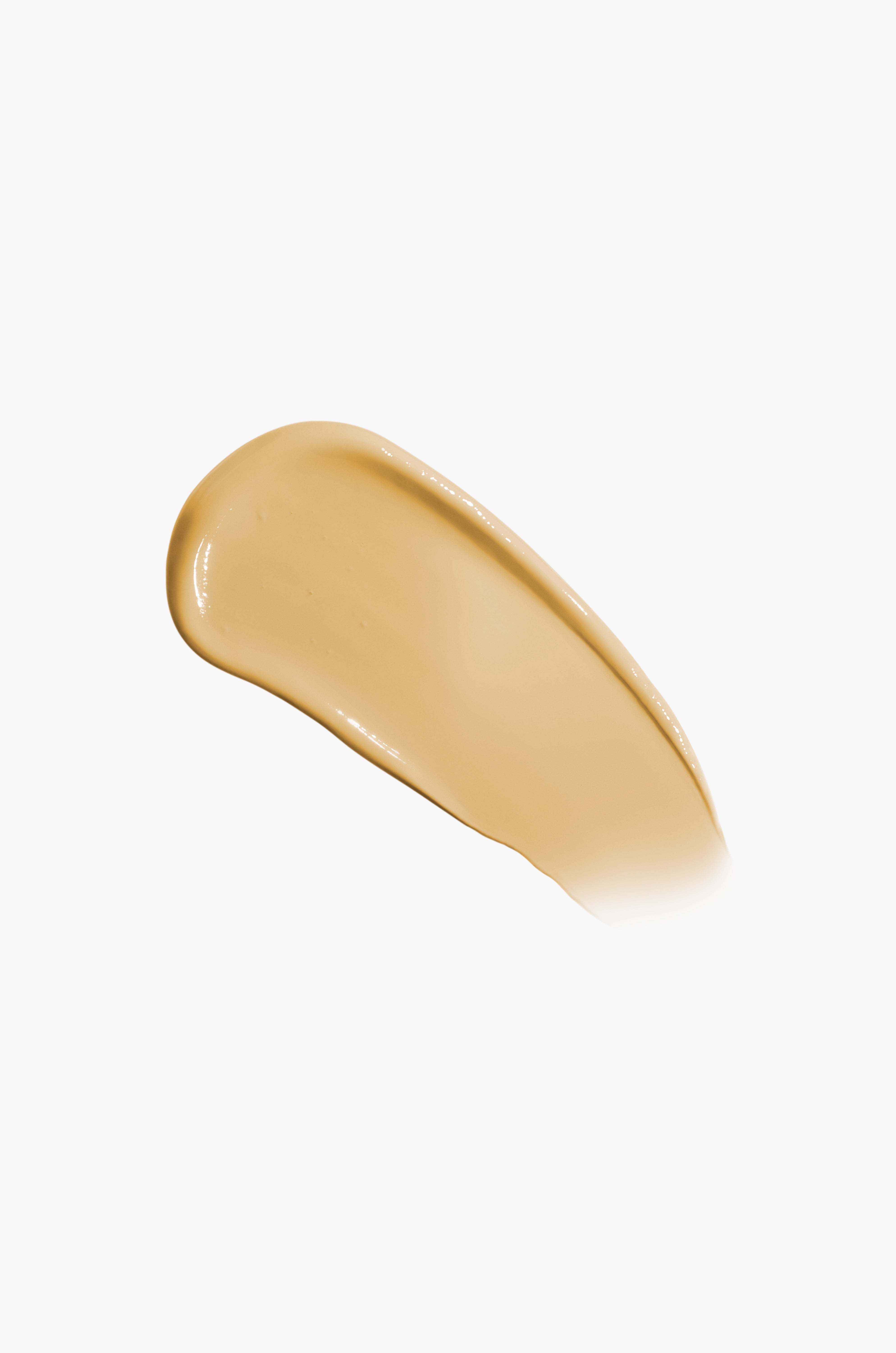 Beige makeup swatch on a white background