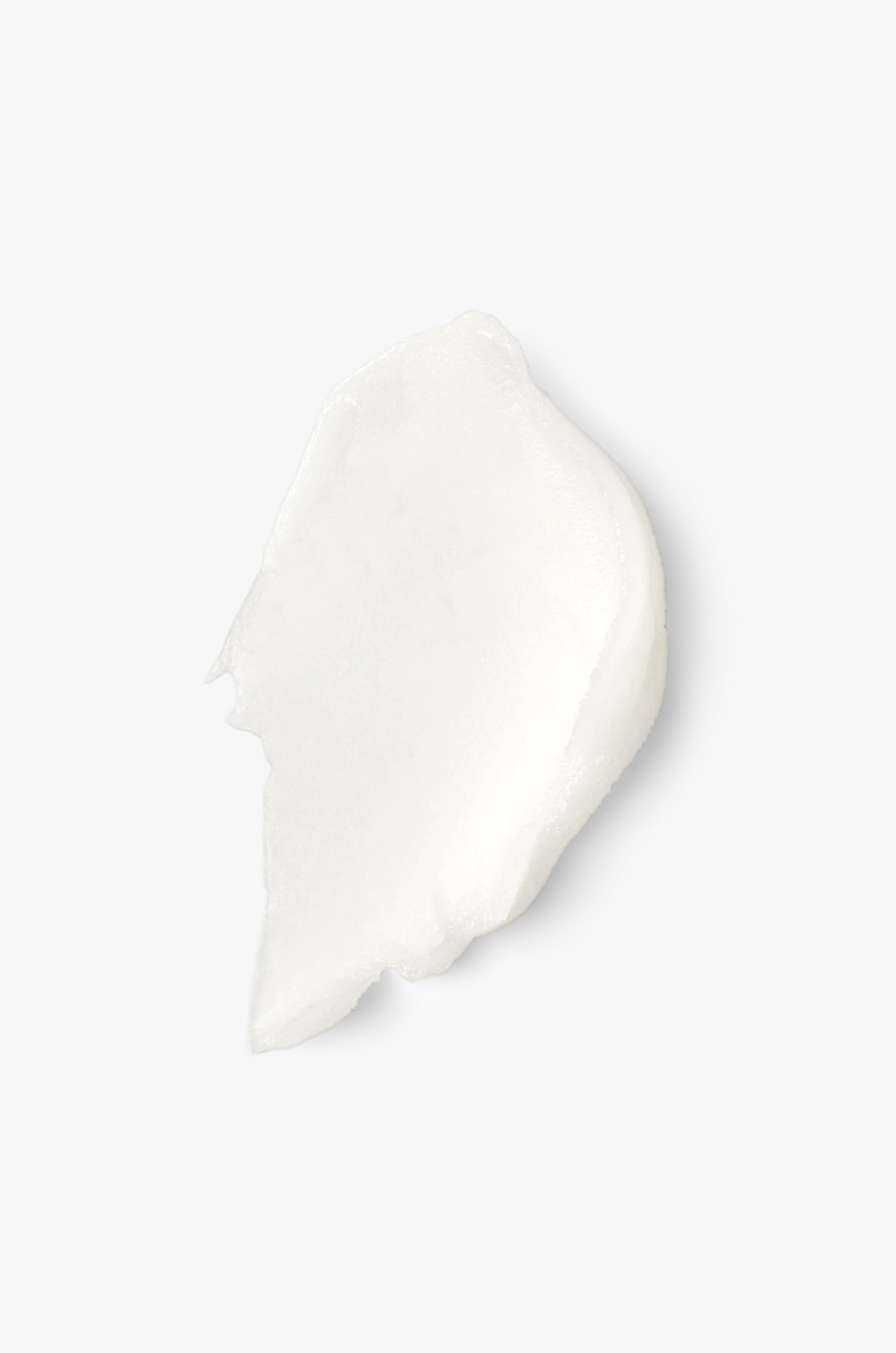 Displays the smear of the lotus glow cleansing balm on a white background.