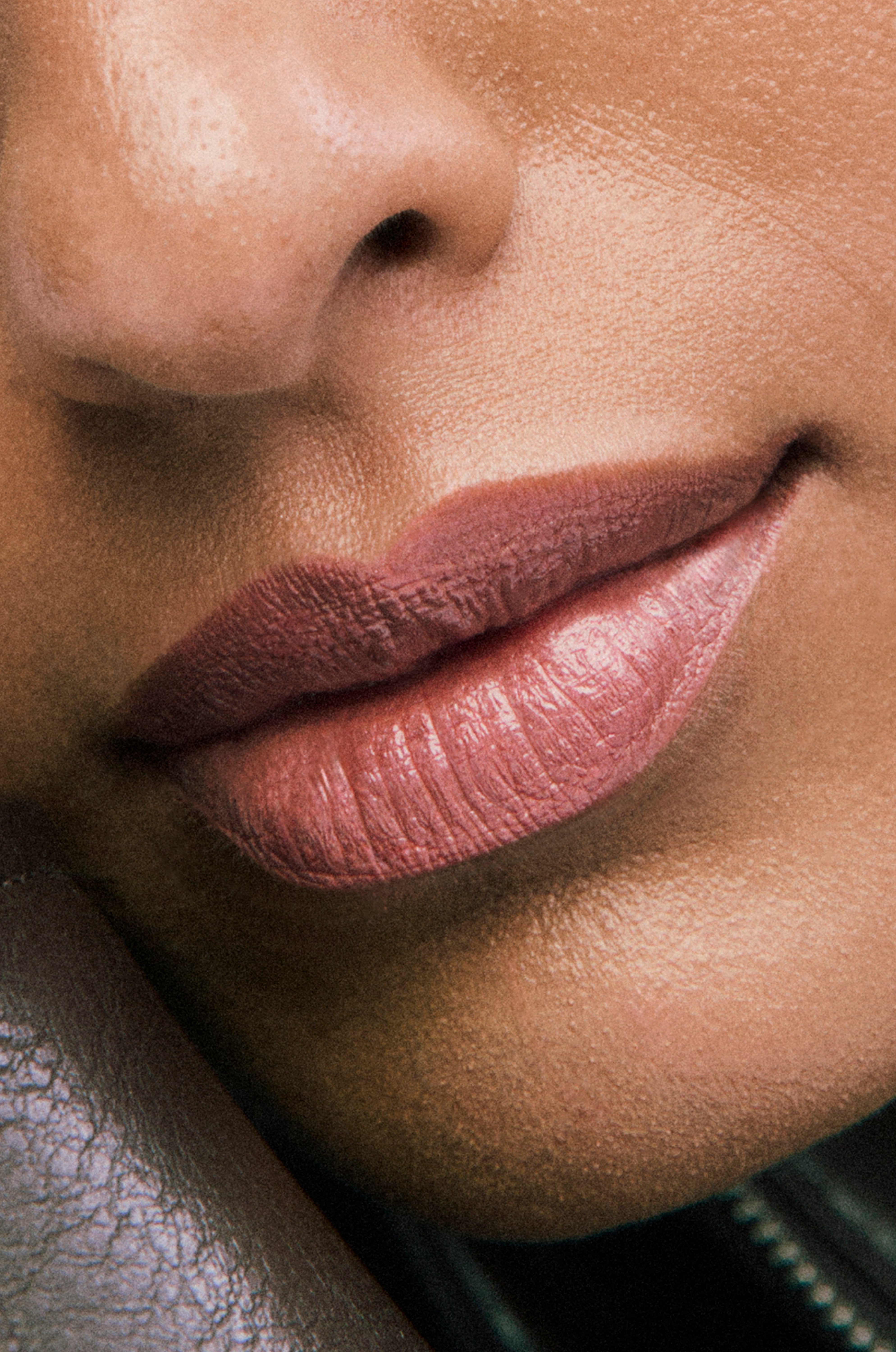 Close-up of a person's lips with a focus on color and texture.