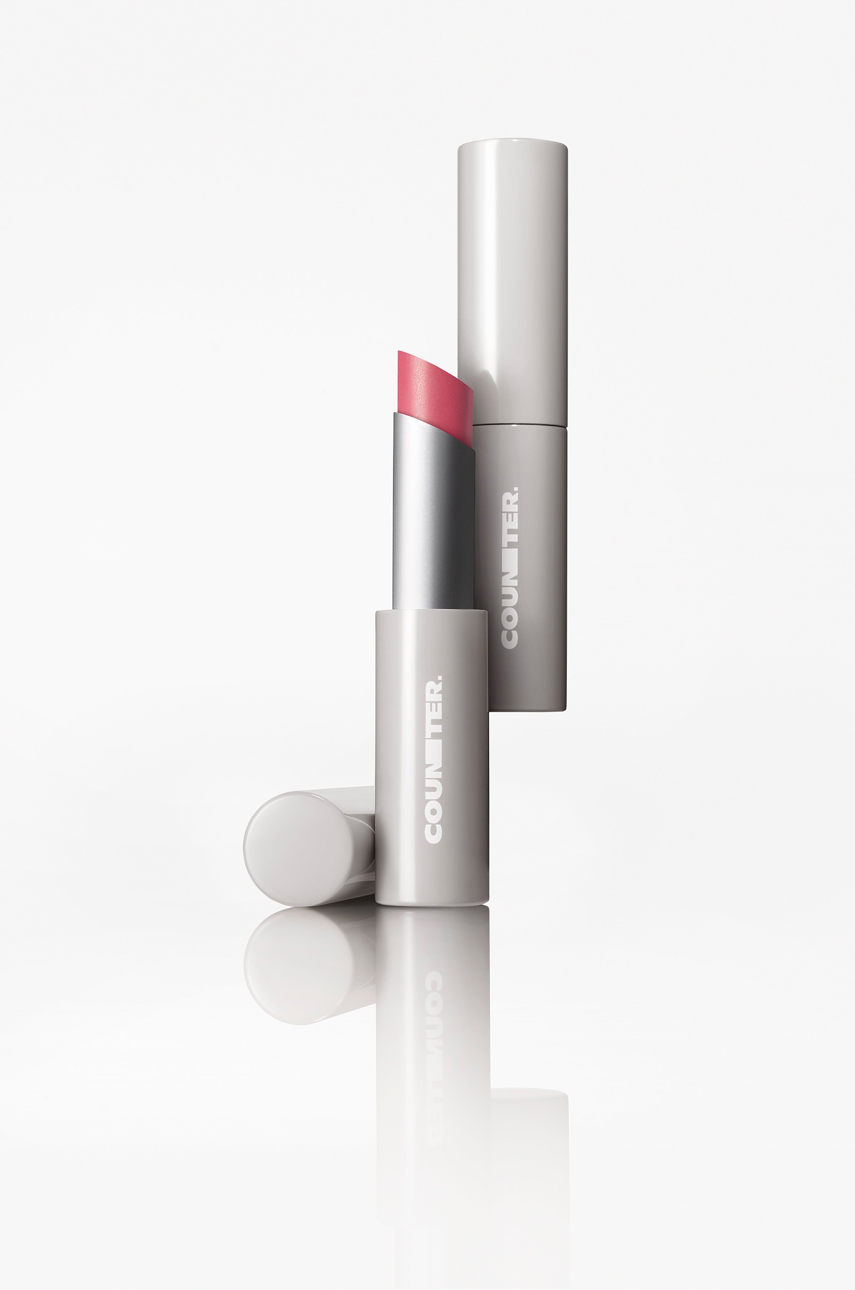 Lipstick with cap on a white background