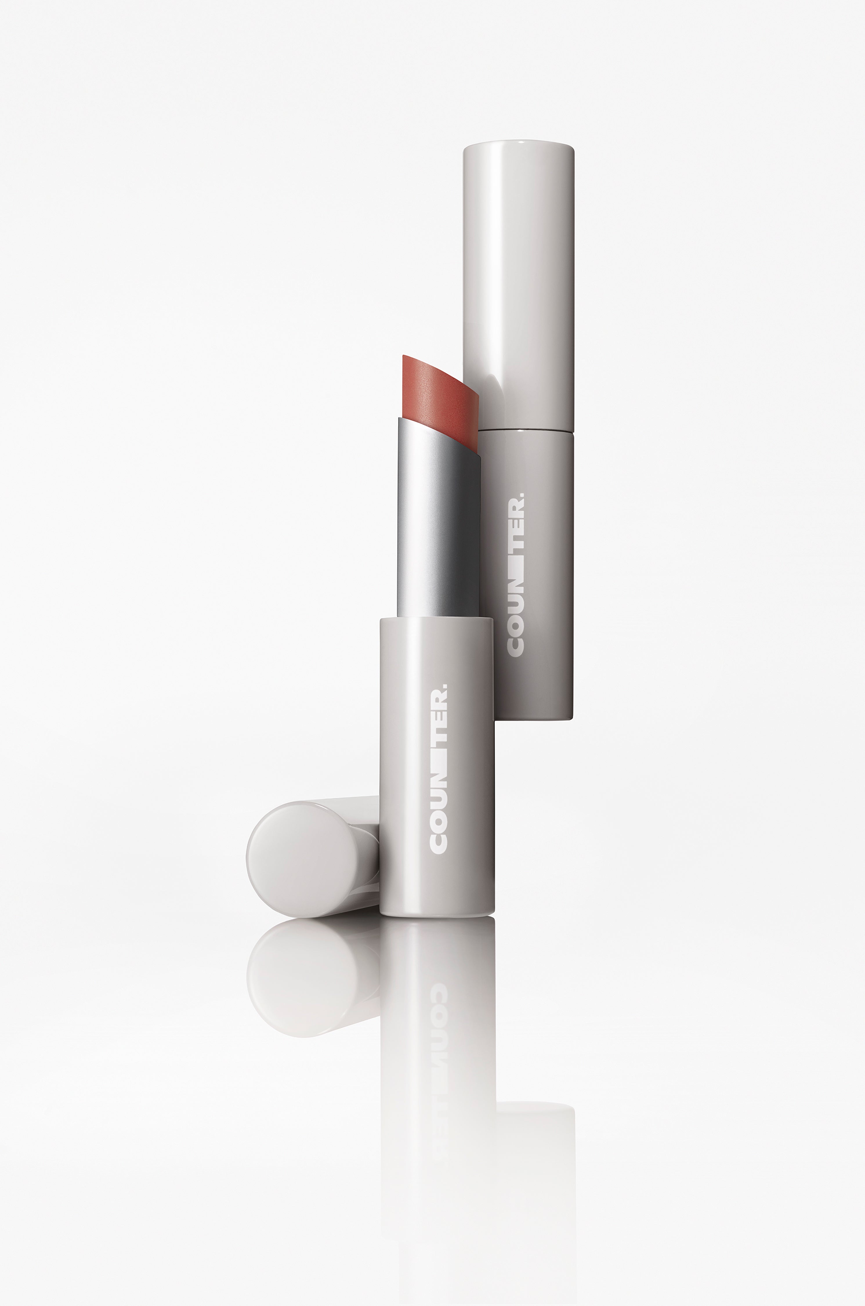 Lipstick with cap on a white background