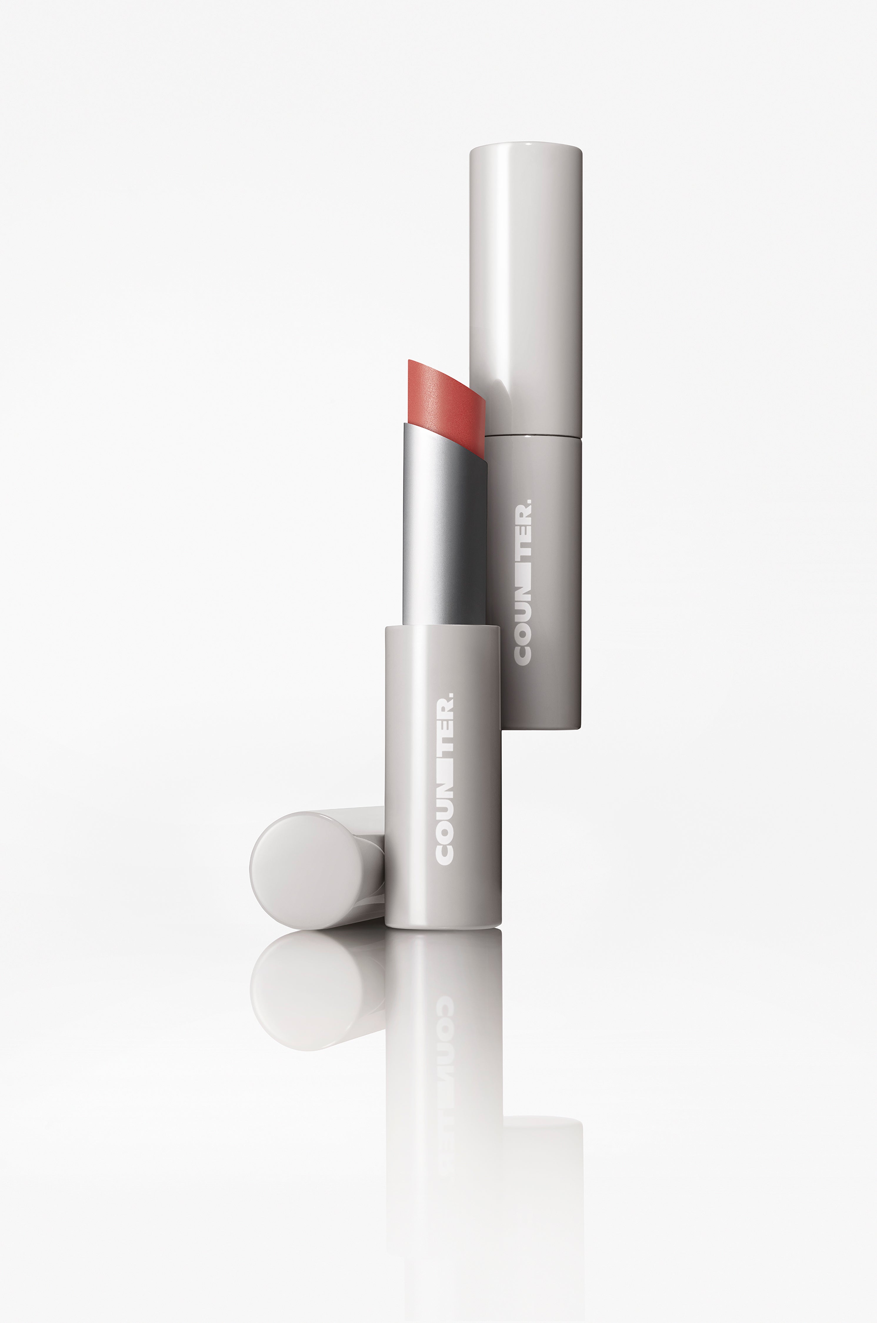 Lipstick with cap on a white background