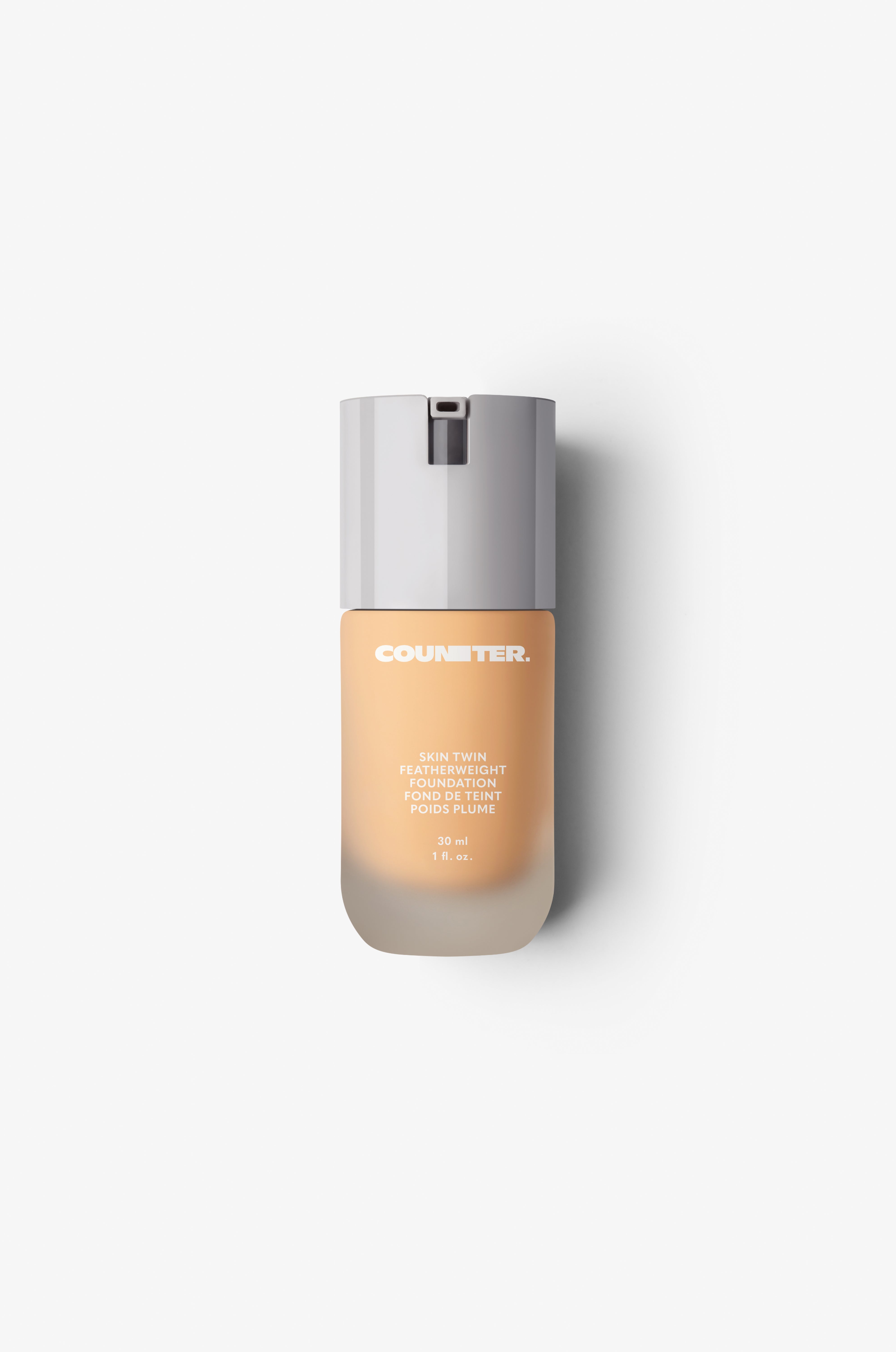 Displays the glass bottle and white lid with foundation shade 310.