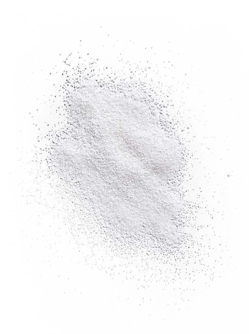 Displays the fine white powder of the exfoliating facial polish.