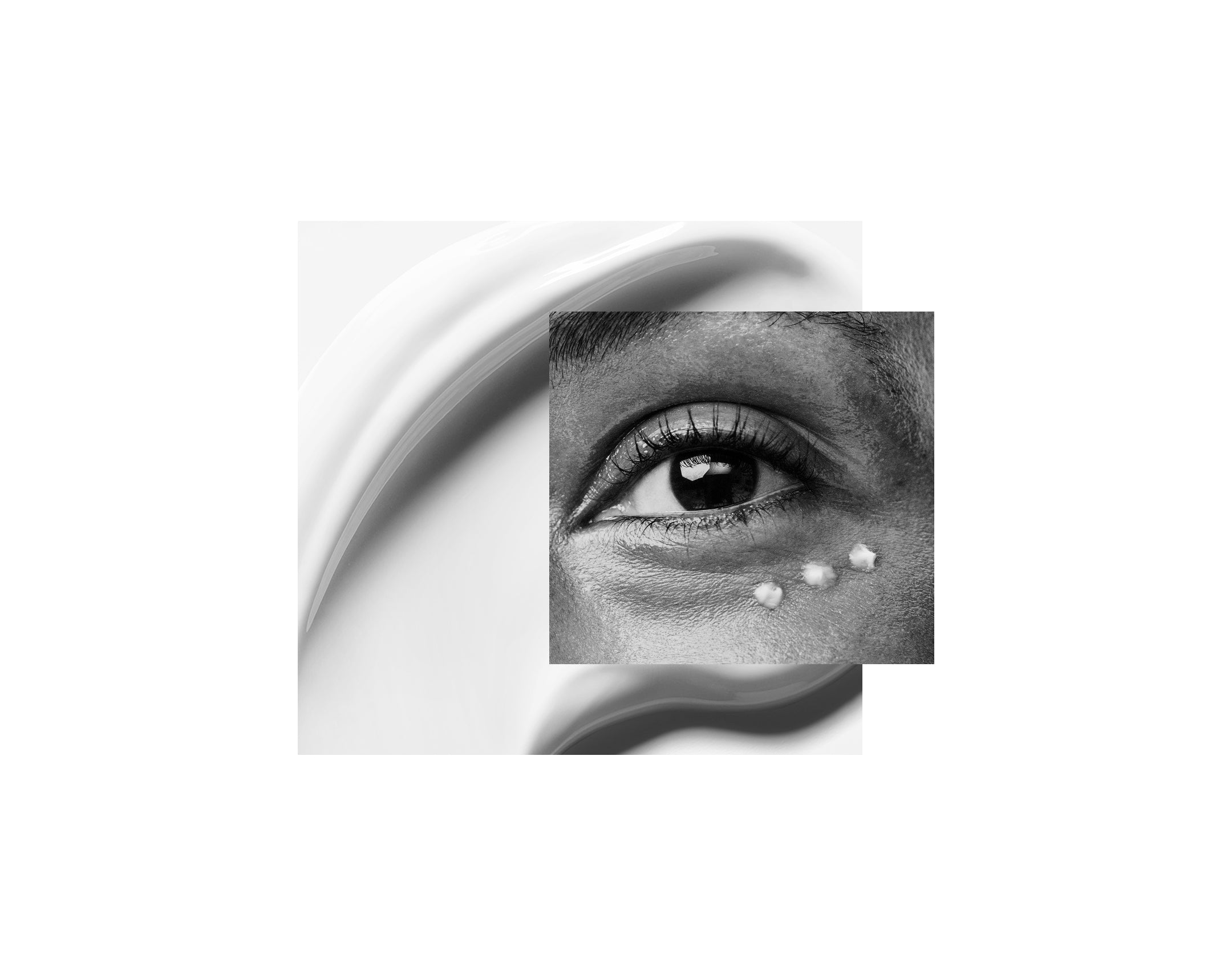 Displays a close up of a model's eye with three dots of product on her under eye overlaying a smear of white Counter product.