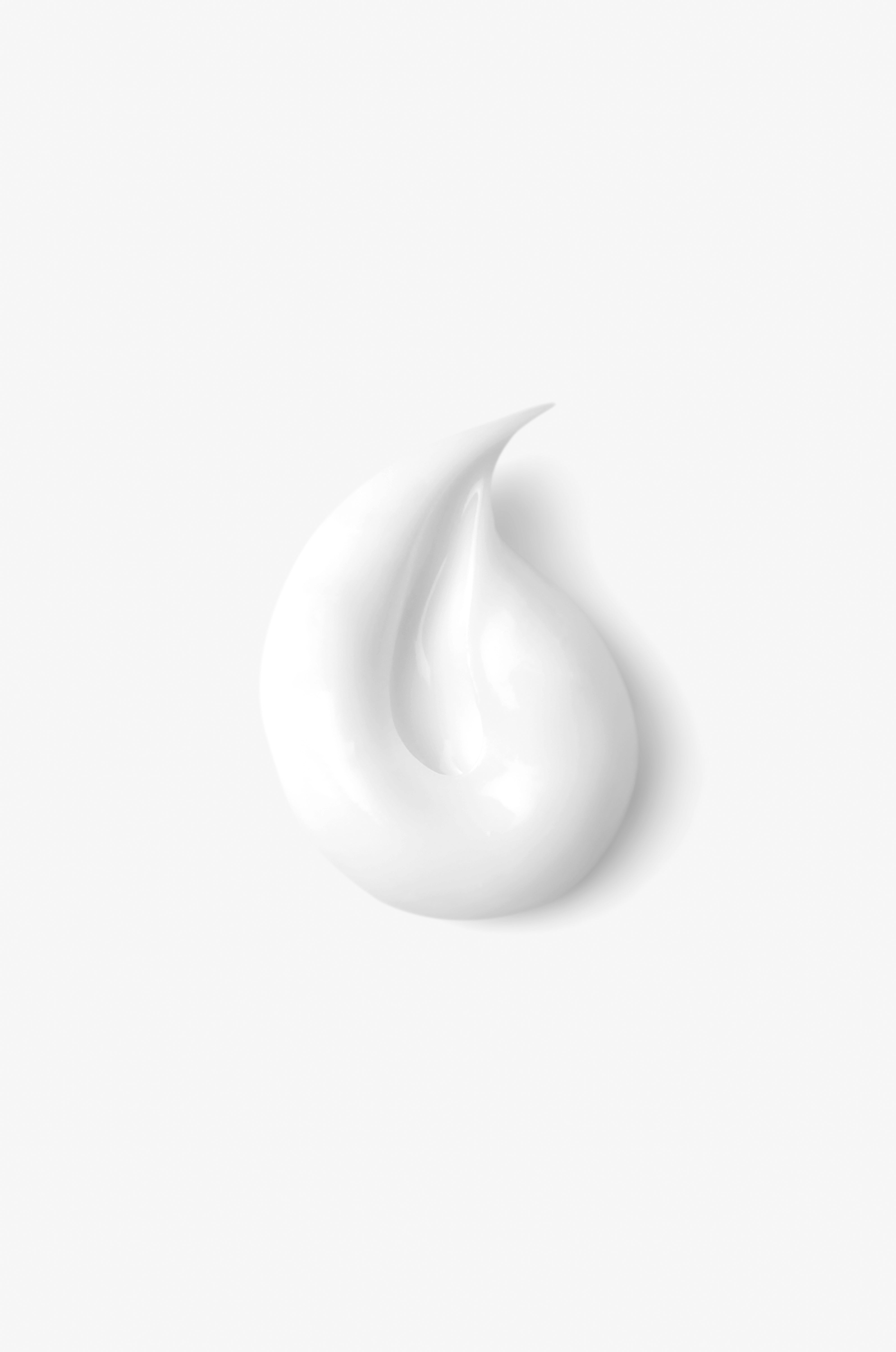 Displays a smear of the counterglow adaptive moisture lotion on a white background. 
